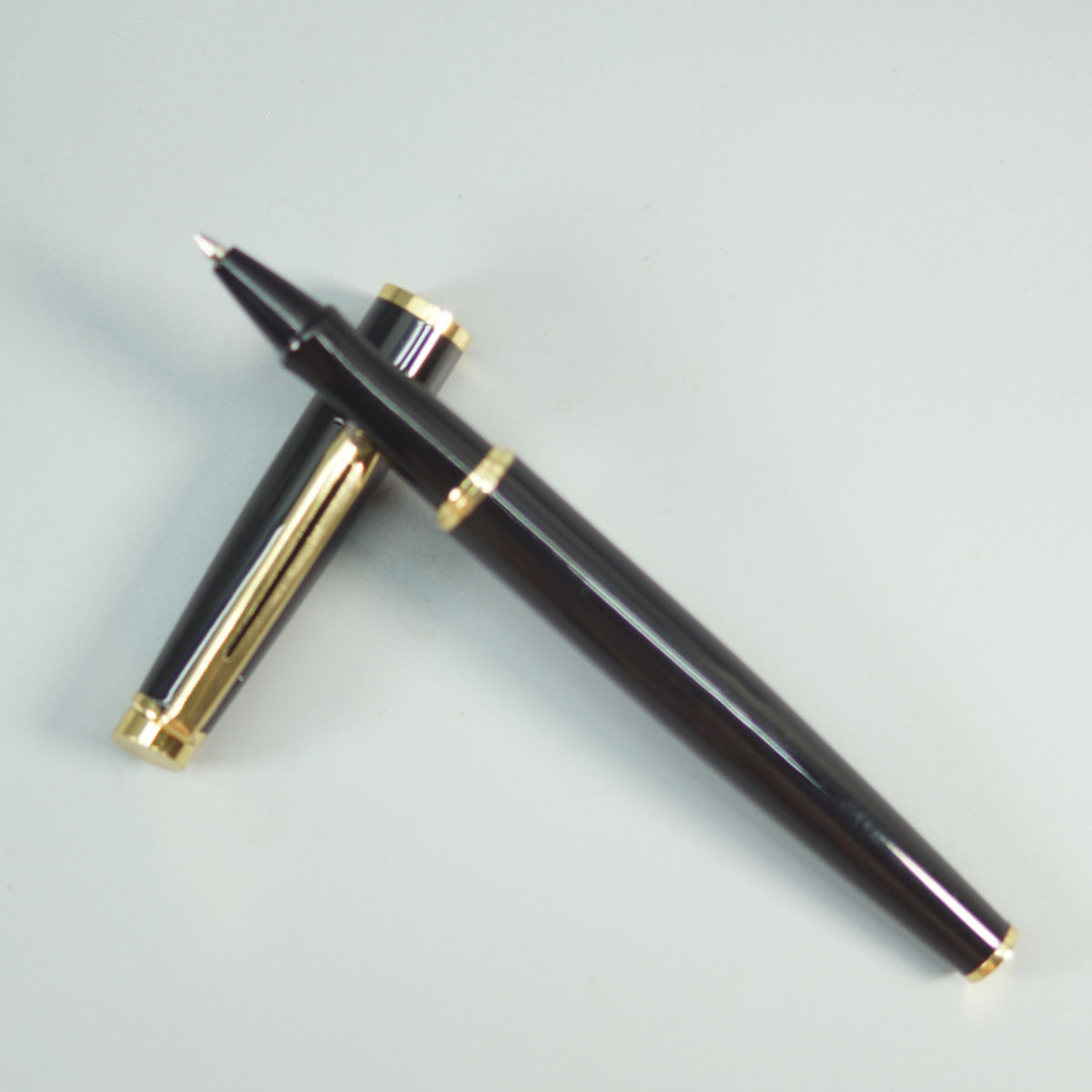 penhouse.in 717 Glossy Black Color Body With Gold Clip And Cap Type Roller Ball Pen SKU 28661