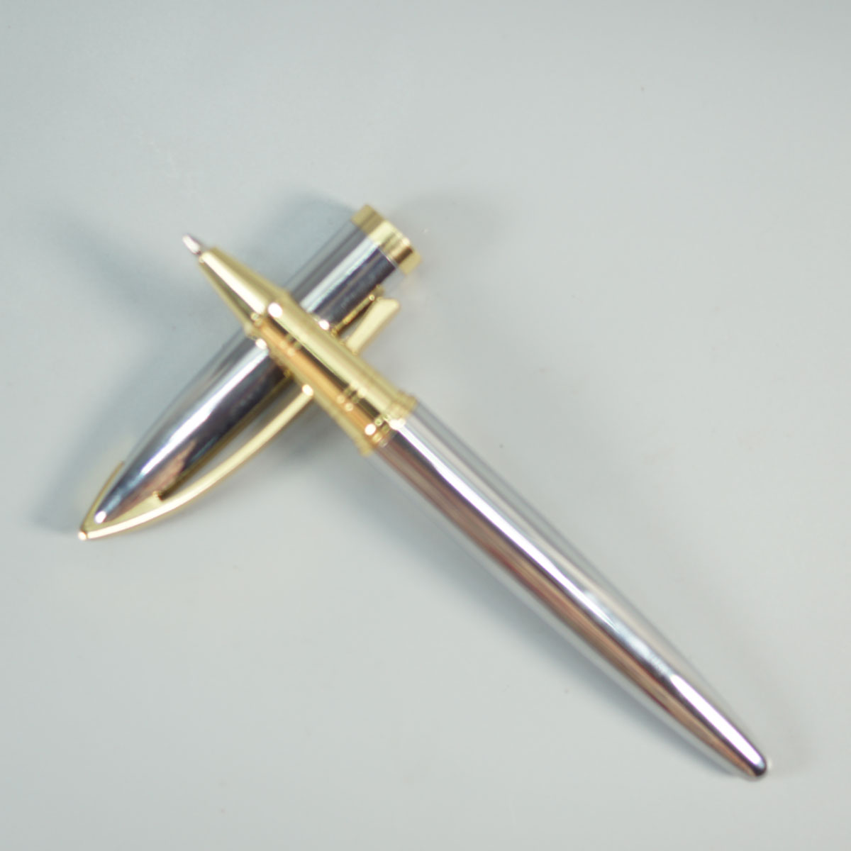 penhouse.in 156 Silver Color Body With Gold Color Trim And Clip Cap Type Roller Ball Pen  SKU 28663