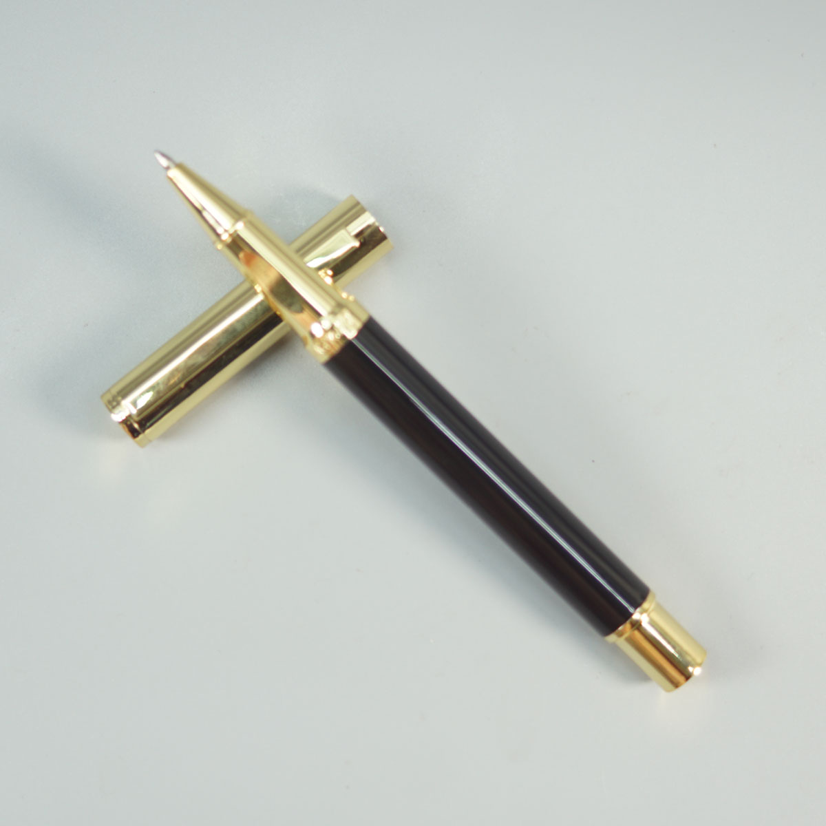 Dikawen 8082 Glossy Black Color Body With Gold  Cap And Roller Ball Pen SKU 28664