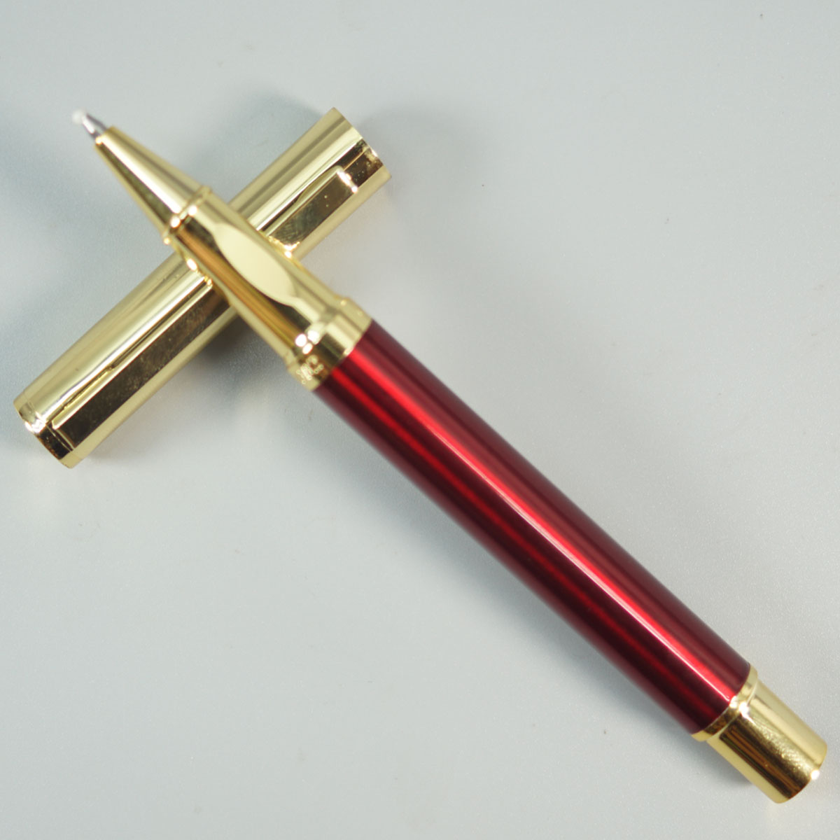 Dikawen 8082 Glossy Red Color Body With Gold  Cap And Roller Ball Pen SKU 28665