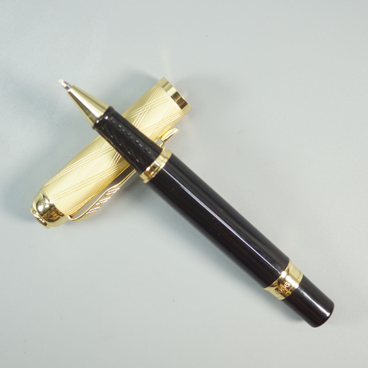 Dikawen 8086 Black Color Body With Design Gold Color Cap And Trim Roller Ball Pen SKU 28676