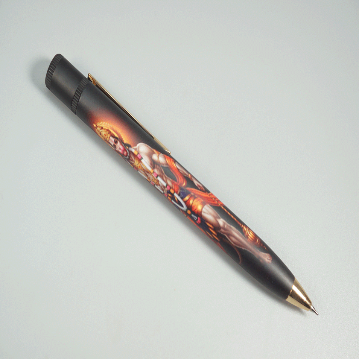 penhouse.in  Ji Hanuman UV Print Black Body with Gold Clip and Grip Fine Tip Twist Type Ball Pen SKU 28799