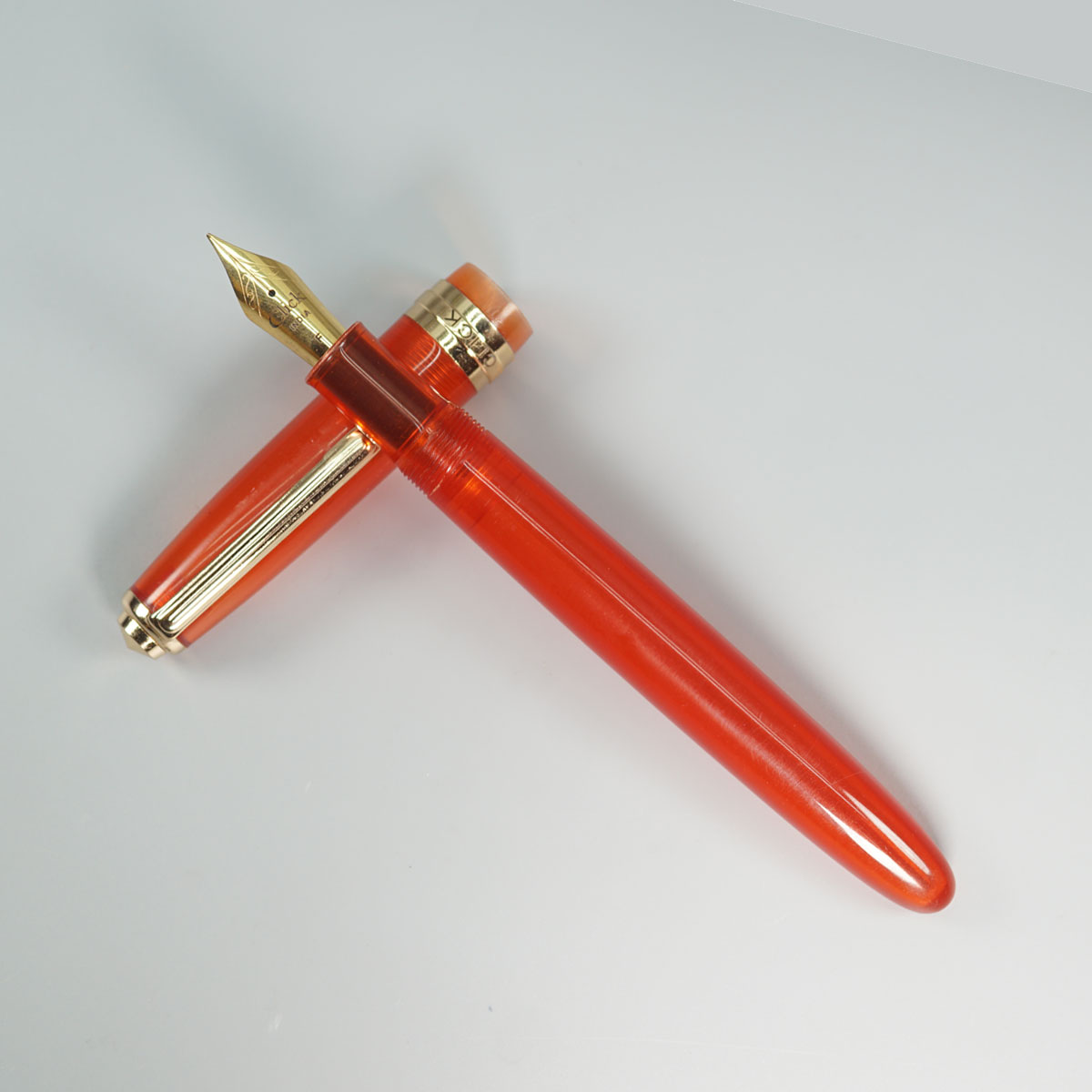 Click Falcon Transparent Orange Color Body With Gold Clip And No.35 Fine Nib (3 in 1) Eye Dropper Model Fountain Pen SKU 28887