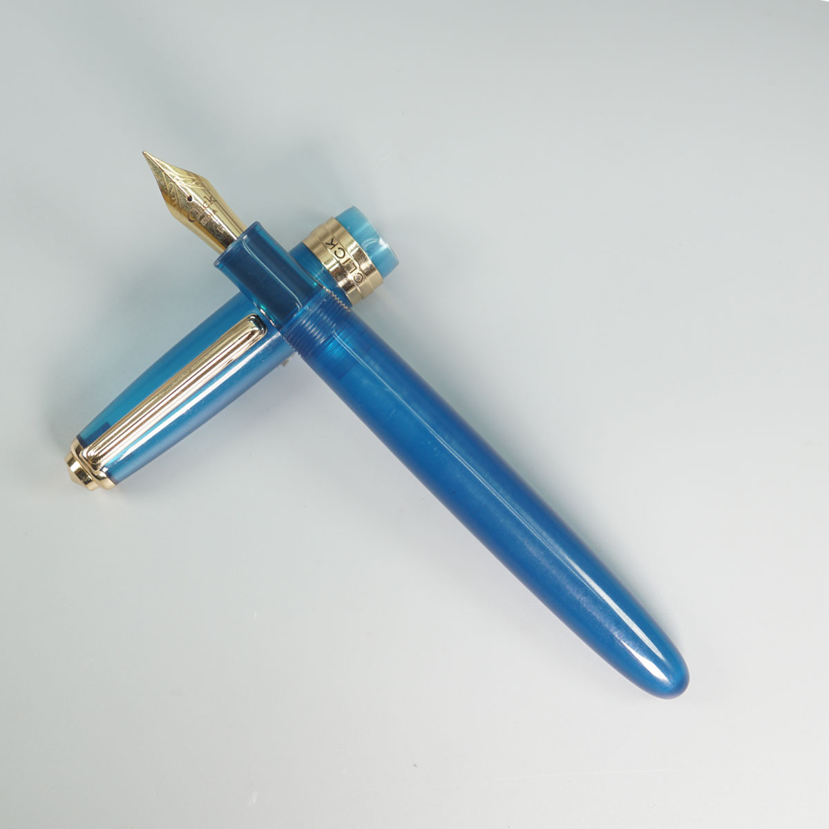 Click Falcon Transparent Turquoise Blue Color Body With Gold Clip And No.35 Fine Nib (3 in 1) Eye Dropper Model Fountain Pen SKU 28890