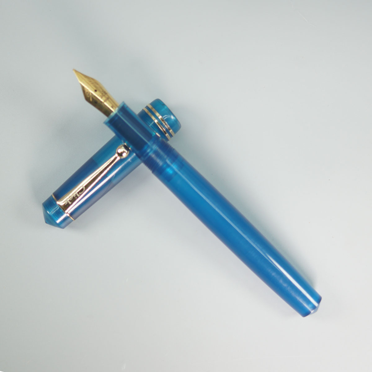 Click Aristocrat Transparent  Turquoise Blue Color Body With Gold Clip And No.35 Fine Nib (3 in 1) Eye Dropper Model Fountain Pen SKU 28893