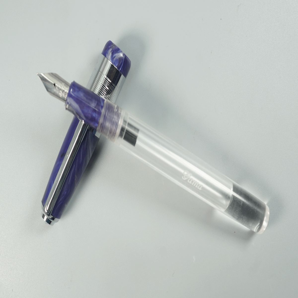 Gama Acrylic Transparent Body with Blue Color Cap and Grip Fine Nib Silver Clip and Trim Eyedropper Fountain Pen SKU 28916