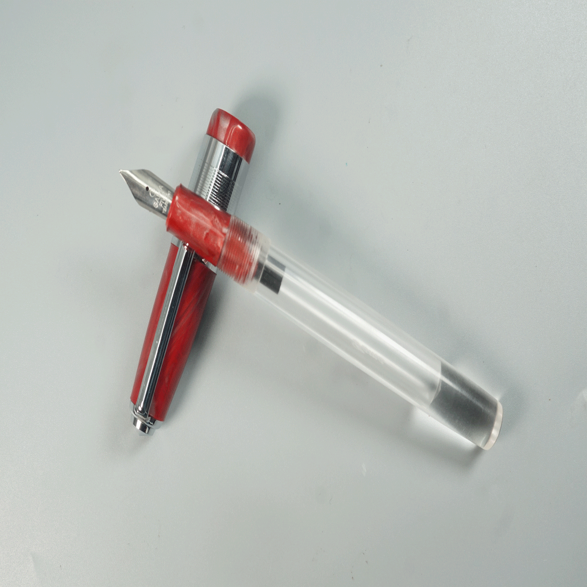Gama Acrylic Transparent Body with Red Color Cap and Grip Fine Nib Silver Clip and Trim Eyedropper Fountain Pen SKU 28917