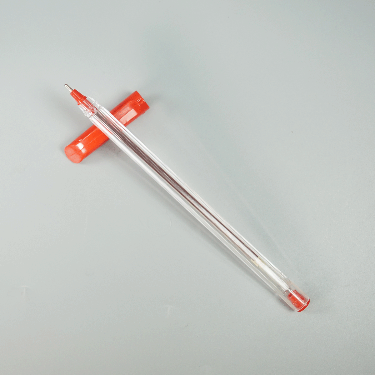 Ukoba Transparent Body With Red Writing Cap Type Ball Pen SKU 28940