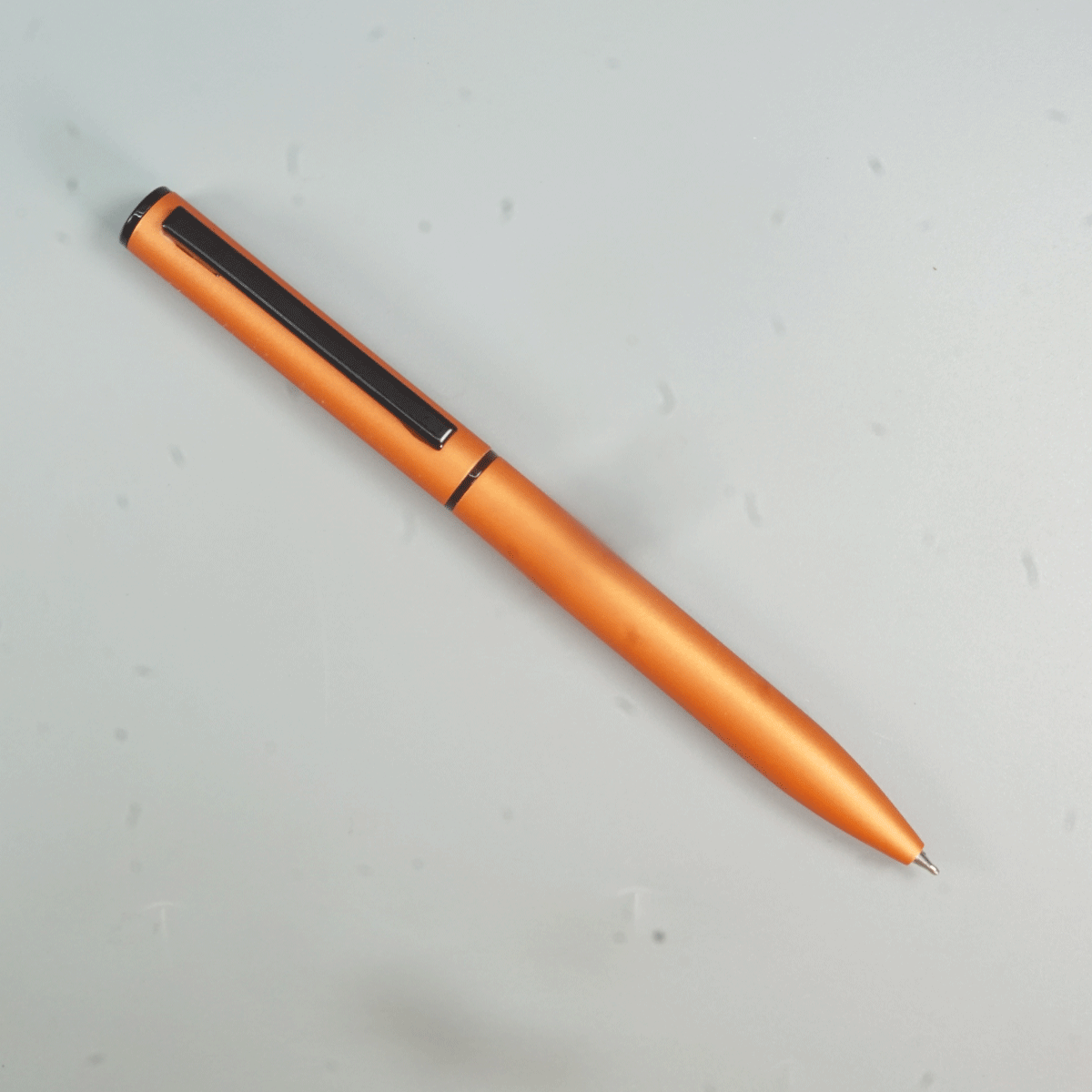 penhouse.in Matte Orange Color Body With Black Color Clip And Twist Type Ball Pen SKU 28942
