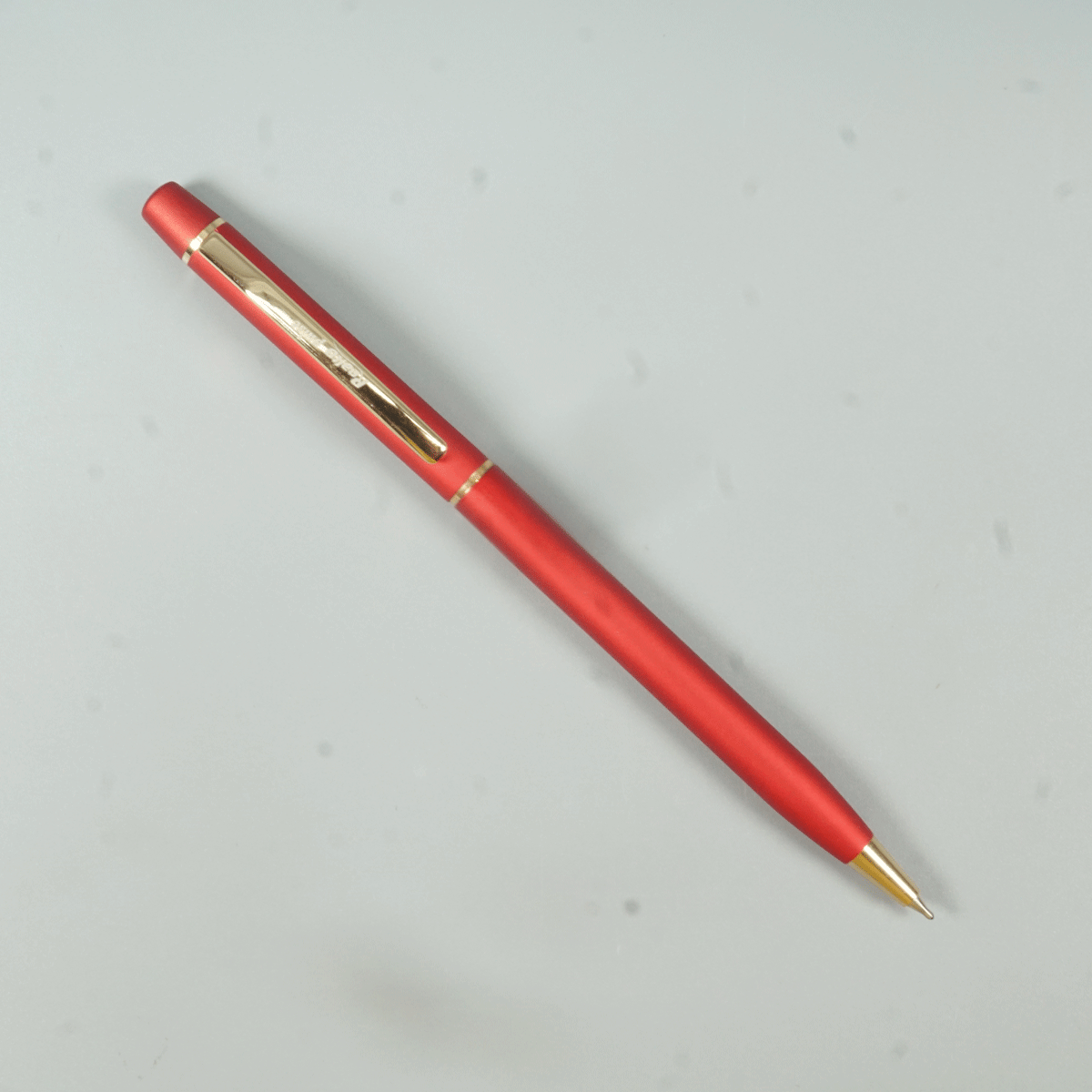 Realto Pulse Red Color Body With Gold Color Clip Slim Twist Type Ball Pen  SKU 28964