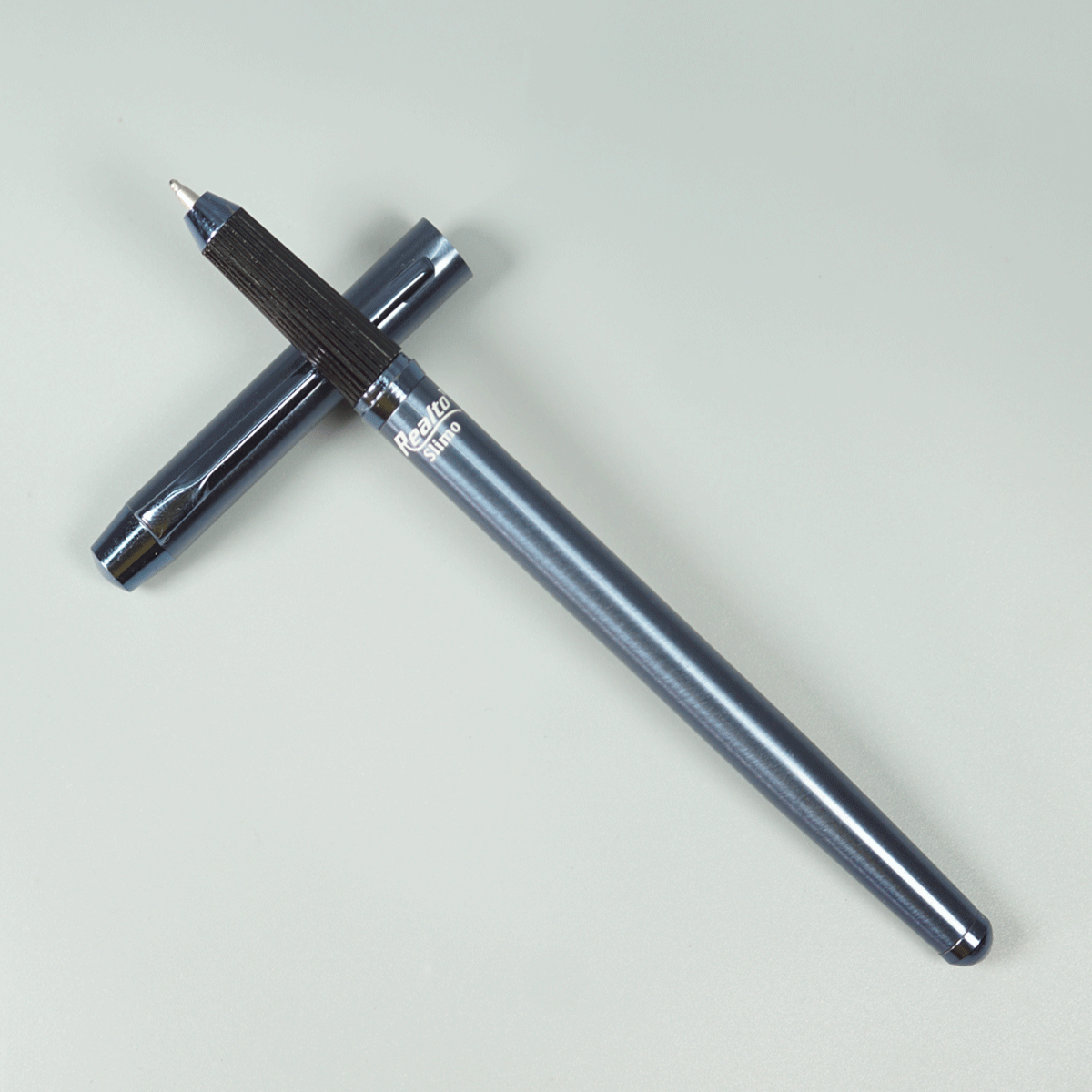 Realto Slimo Blue Color Body With Black Color Grip And Magnetic  Cap Type Ball Pen SKU 28980