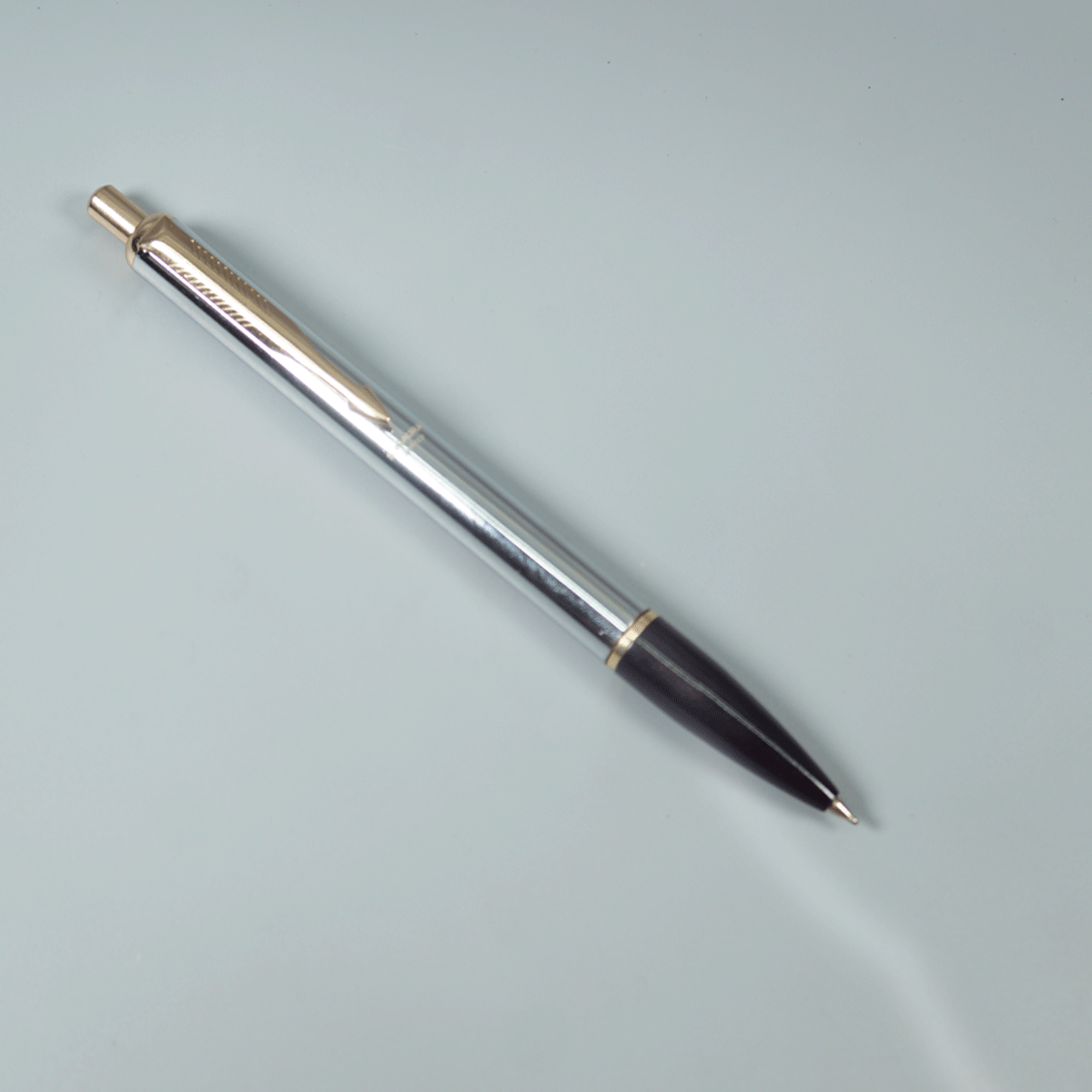 Sigaura Galaxy Steel Silver With Black Color Body With Gold Clip Rectractable Trim Fine Tip Ball Pen SKU 29096