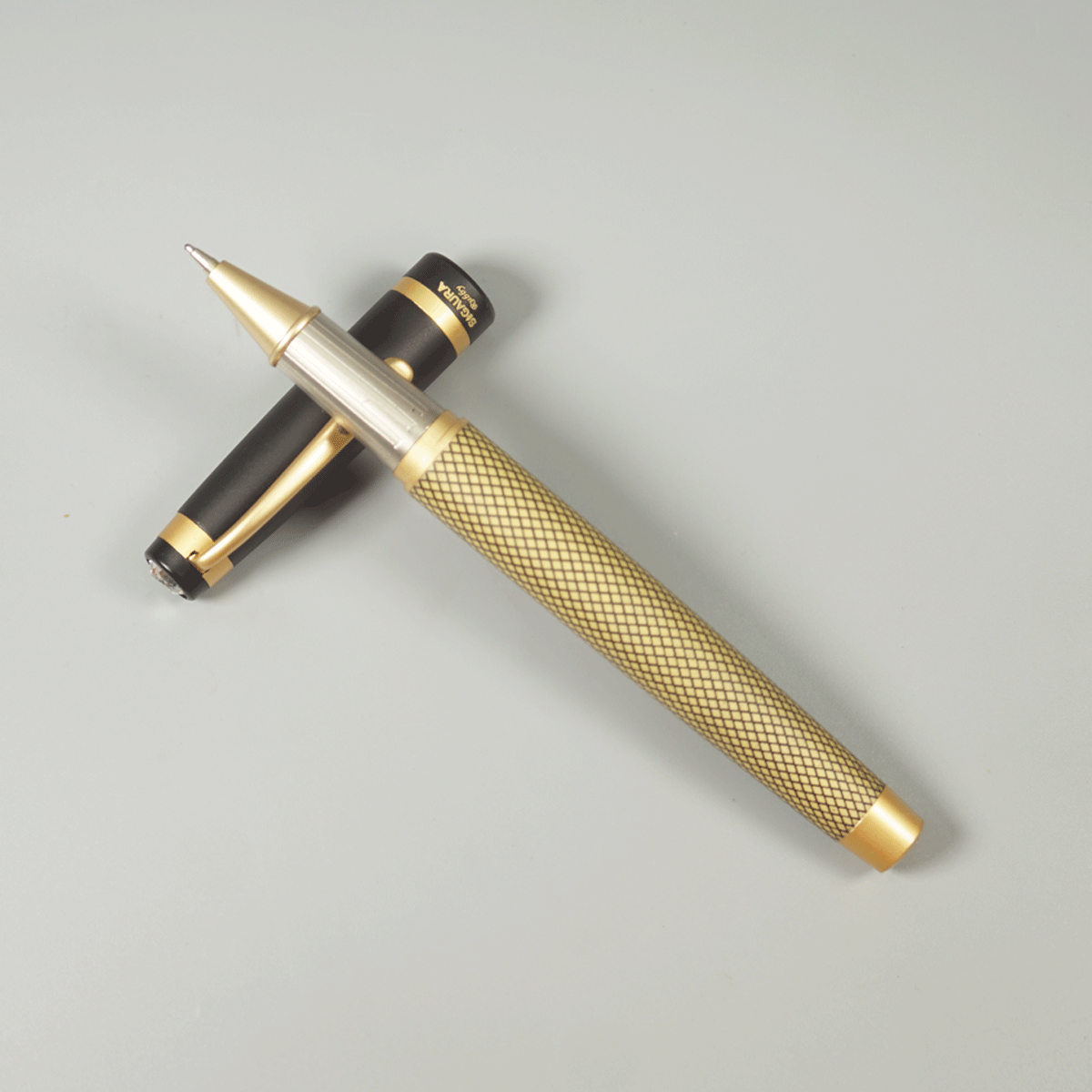 Sigaura Rubby Half Gold Chess Color Body With Gold Clip And Black Cap Top On White Stone Trim Fine Tip Cap Type Ball Pen SKU 29098