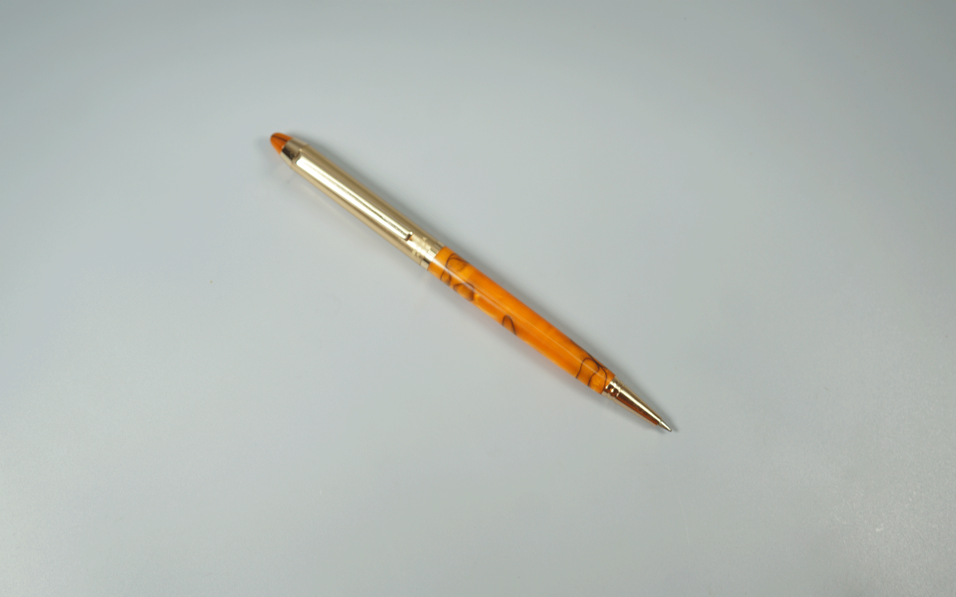 Sigaura Aurum Crystal Half Gold With Orange Color Body And Trim Fine Tip Twist Type Ball Pen SKU 29101