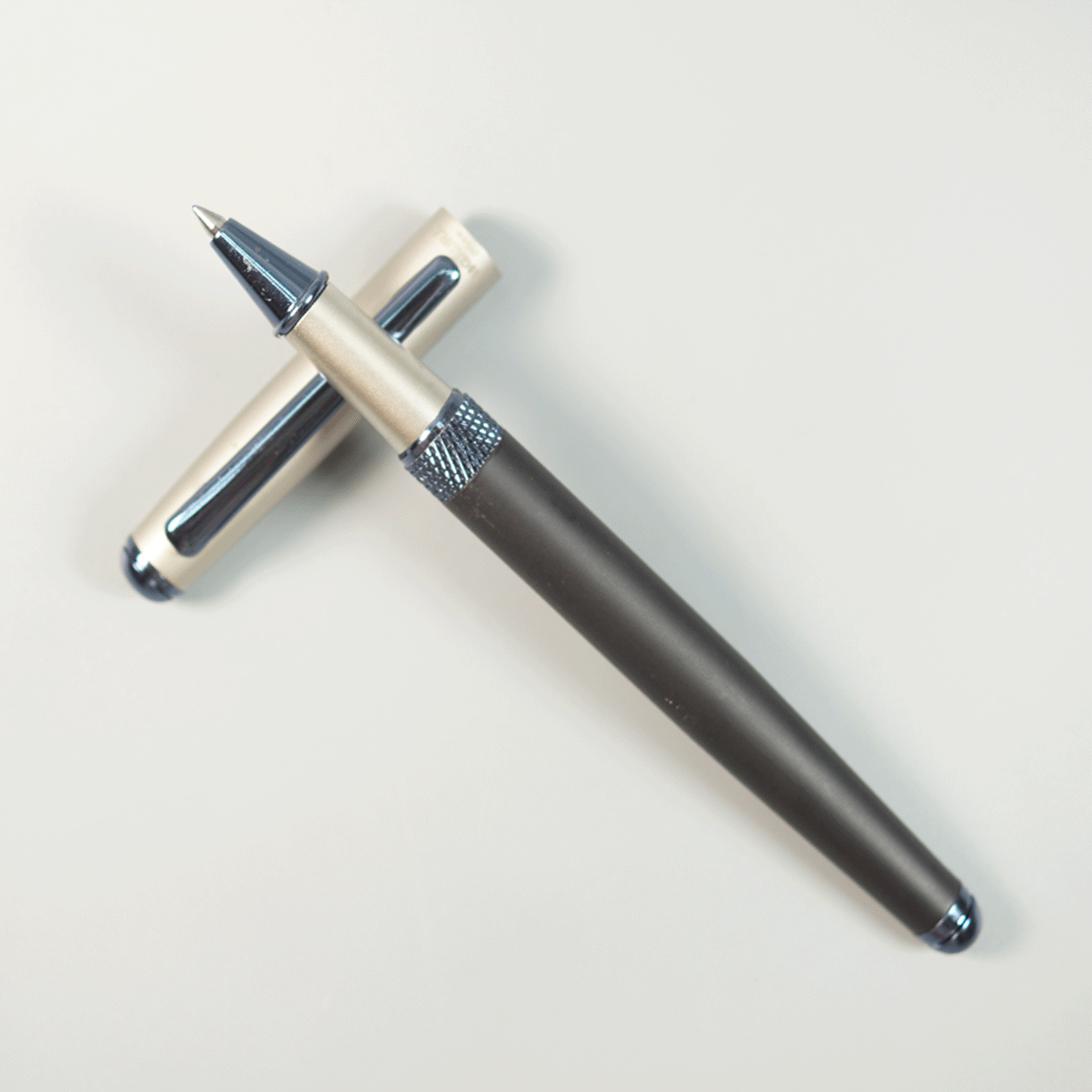 Sigaura Matte Black Color Body With Cream Cap And Blue Clip Medium Tip Cap Type Roller Ball Pen SKU 29105