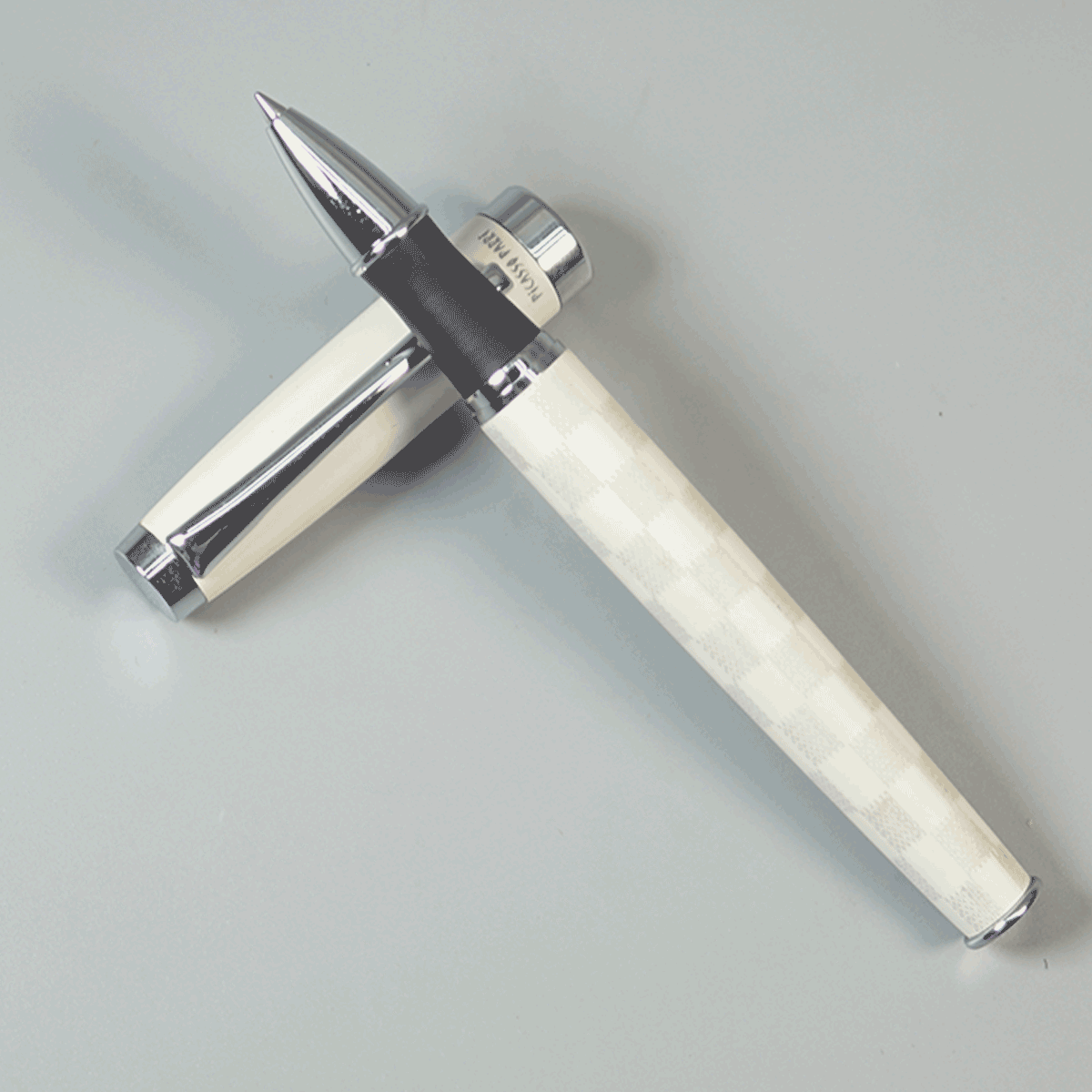 Picasso Parri Checkers White Color Body With Black Grip And White Cap With Silver Clip With Matte Type Roller Ball Pen SKU 29156