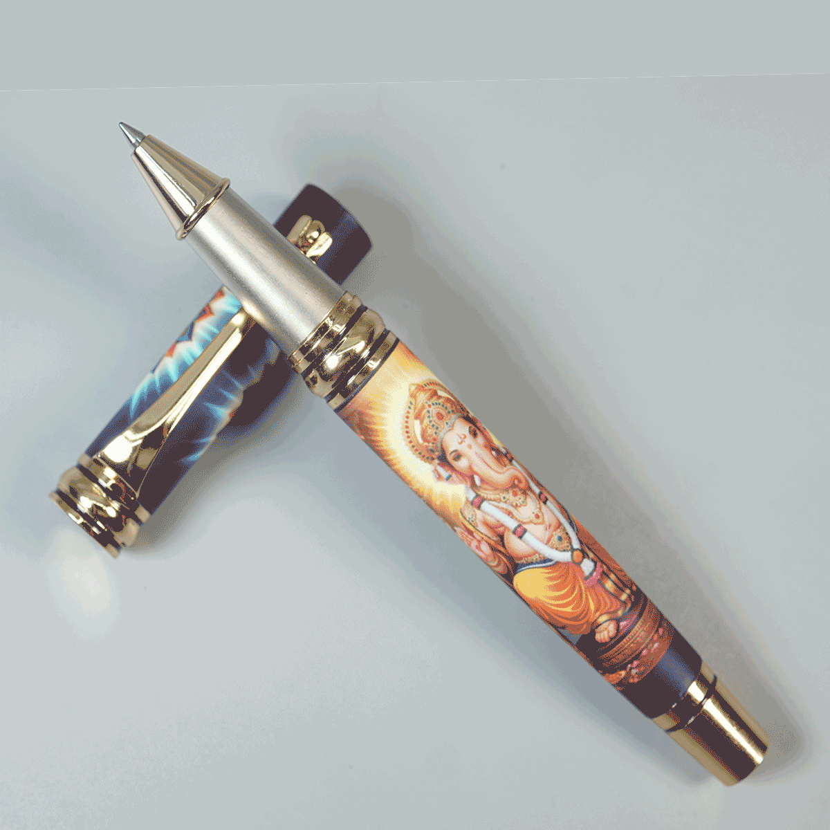 Penhouse.in Pens Featuring Graphic Print Of Lord Ganpati With Gold Color Body And Gold Grip Fine Tip Devotional Roller Ball Pen SKU 29158