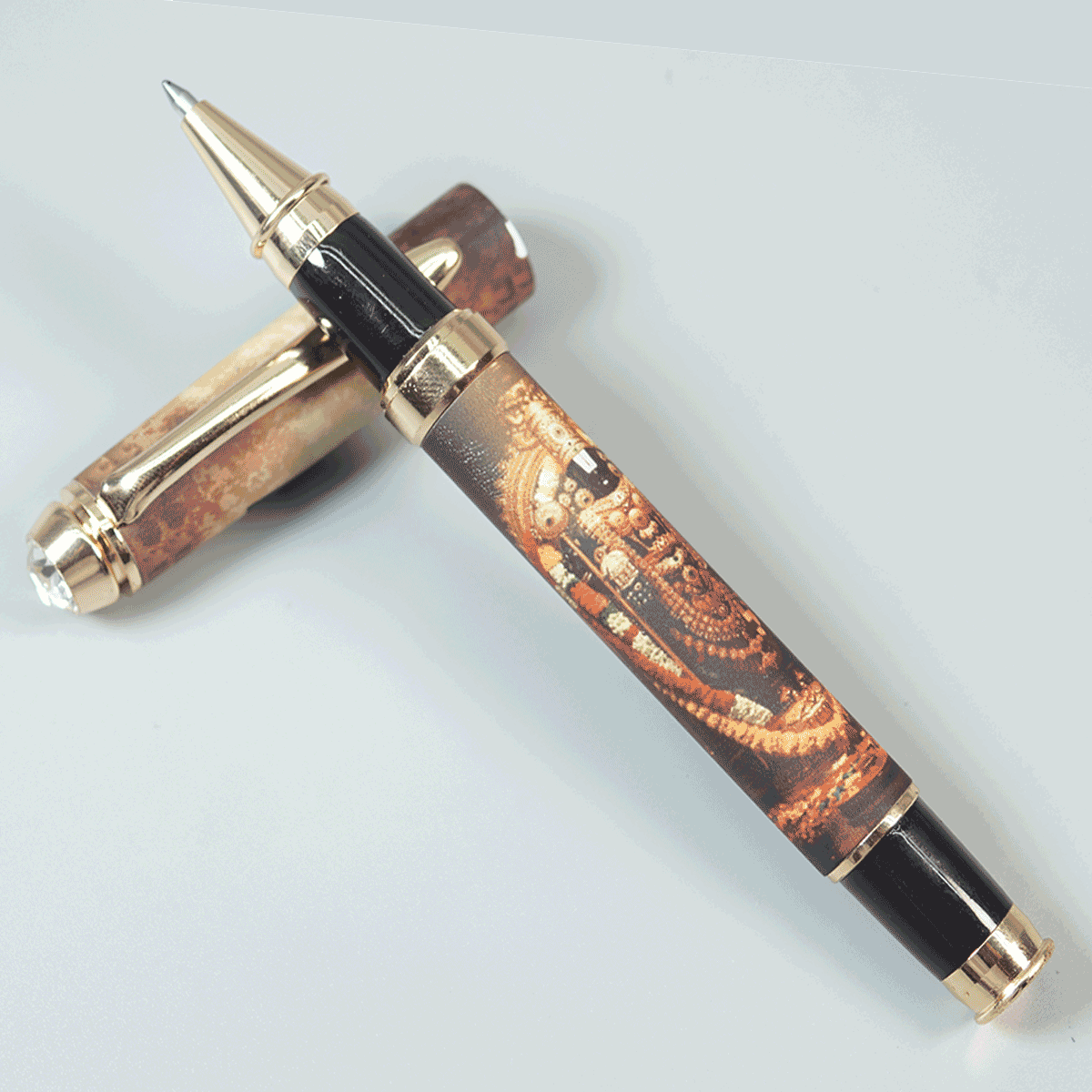 Penhouse.in pens Featuring Graphic Print Of Lord Tirupati Balaji With Gold Color Body Gold Grip With White Stone On Cap Fine Tip Devotional Roller Ball Pen SKU 29160