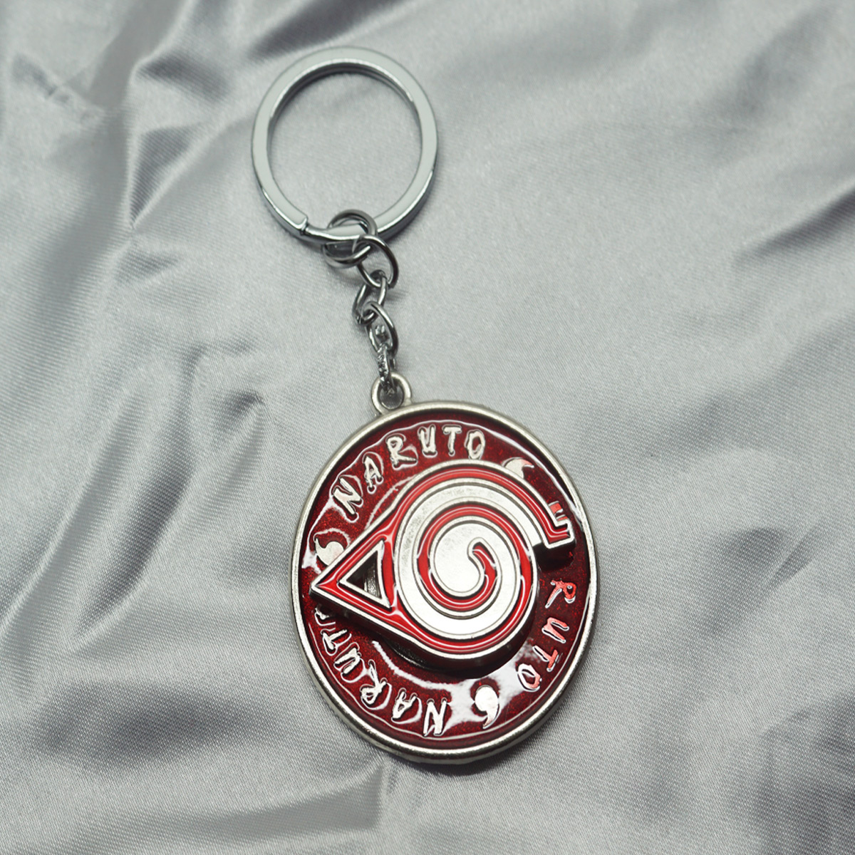penhouse.in Naruto Leaf Symbol Spinning Red and Silver Color Metal Keychain SKU KP350