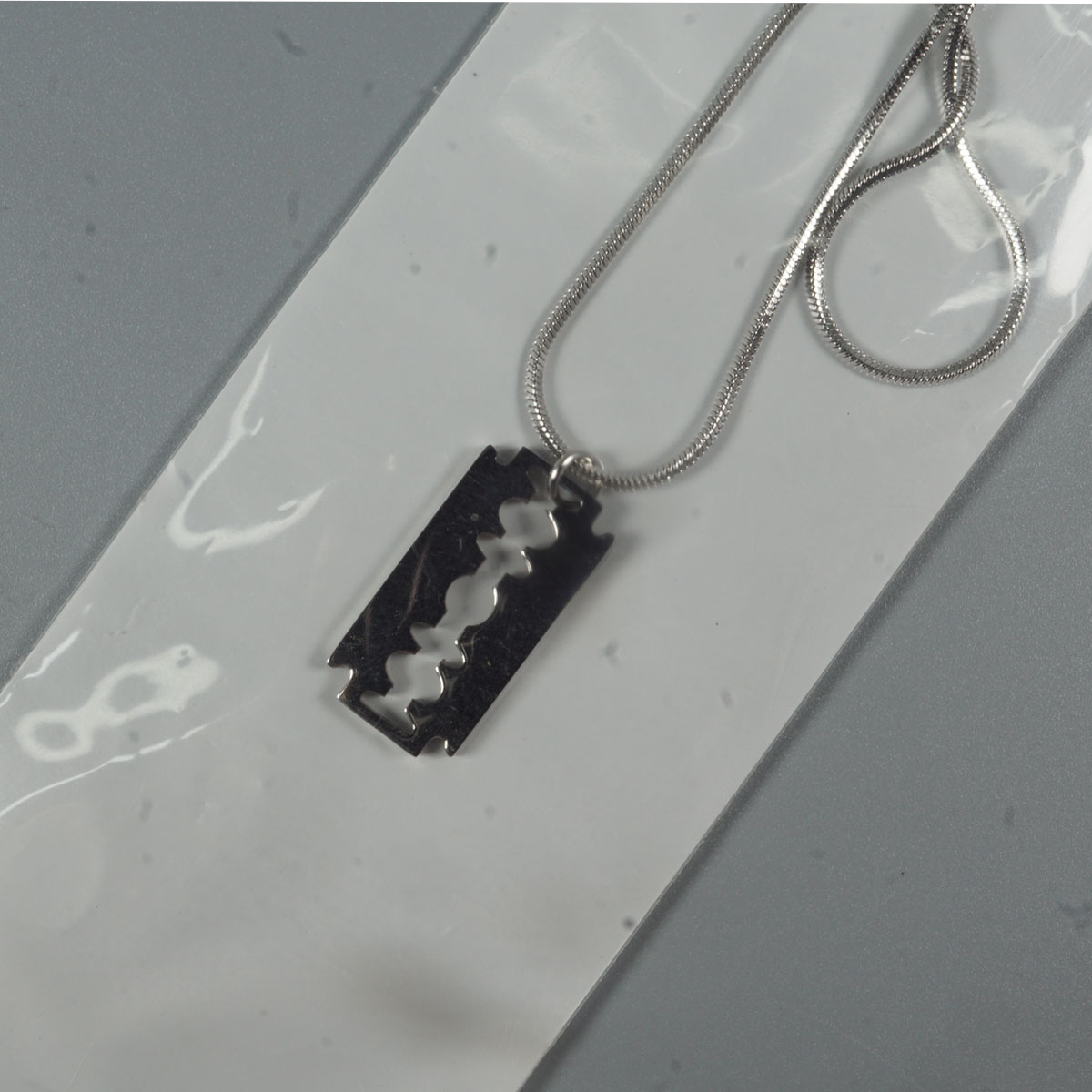 penhouse.in Silver Color Double -Edge Razor Blade  Neck Chain SKU 51923