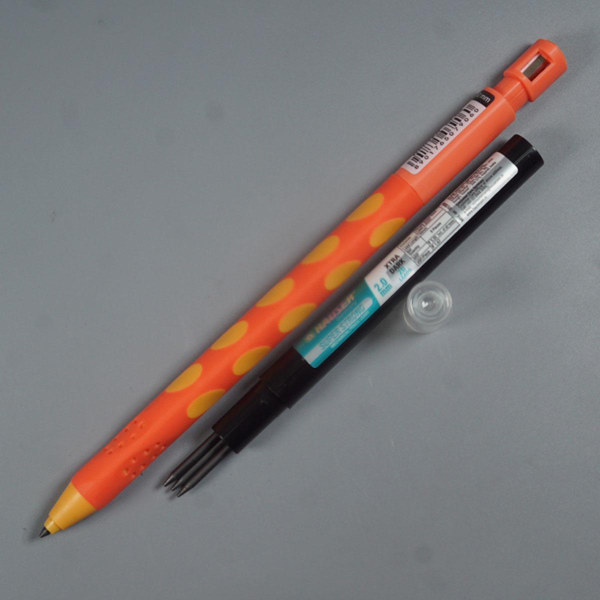 Hauser  One 2.0 mm orange Color Body With Dotted Designed Grip Patttern Built-in Sharpener ractactable Type Mechanical pencil  SKU 52219