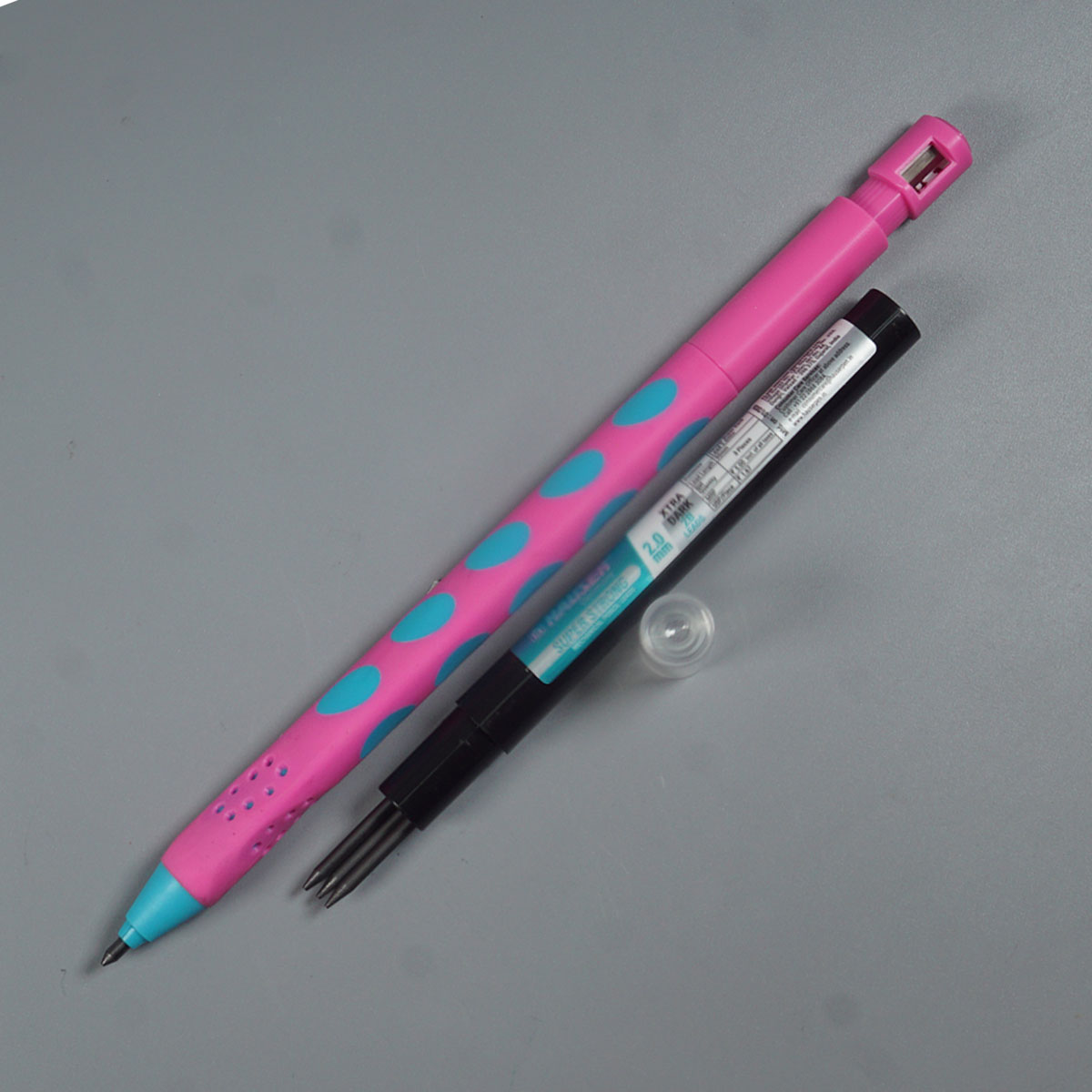 Hauser  One 2.0 mm Pink Color Body With Dotted Designed Grip Pattern Built-in Sharpener ractactable Type Mechanical pencil  SKU 52221