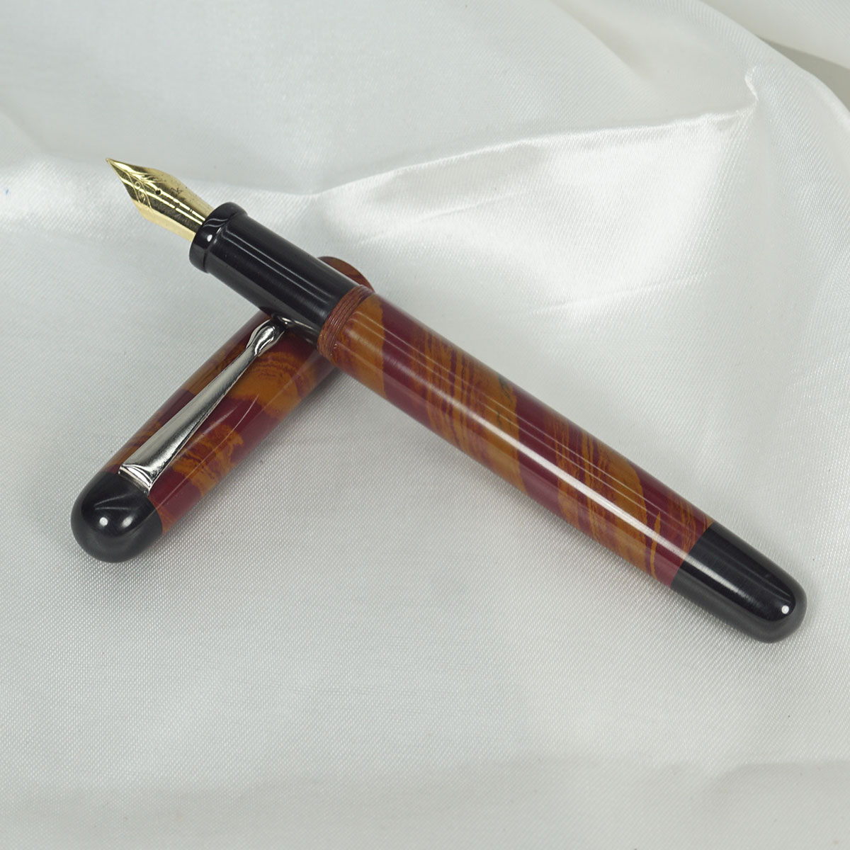 WOW Brand Model - 1008A Magizham (மகிழம்) Handmade Ebonite Pen Orange and Red Color  Marble finish Body and Cap with Black Color Top and Bottom Finial, Black Color Section SKU 60012