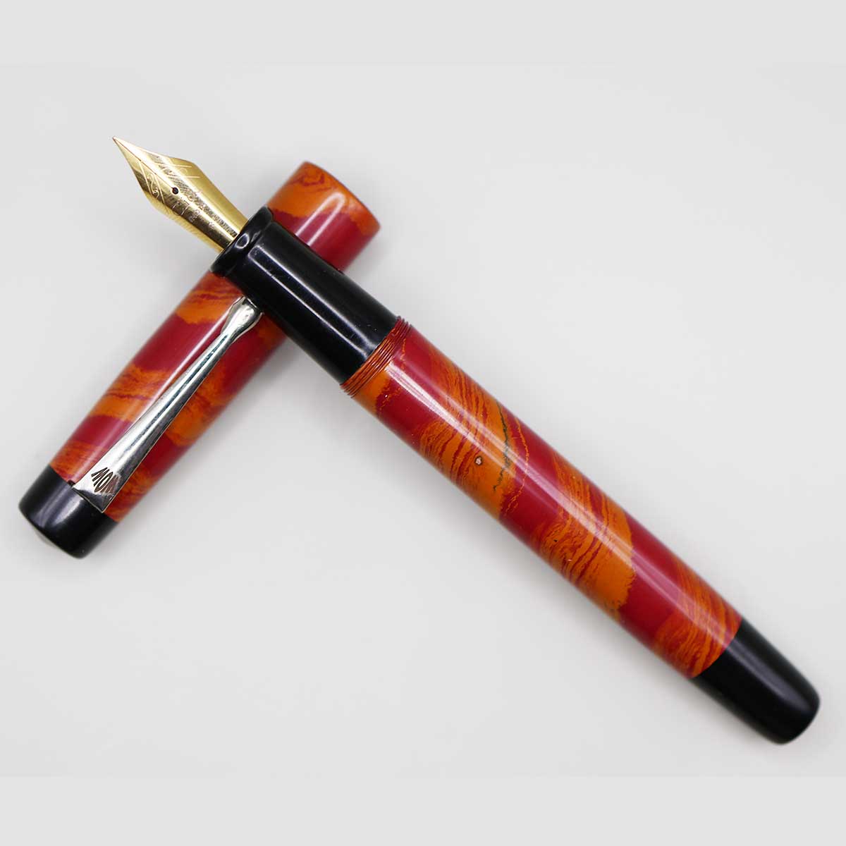 Wow Brand Model – 1008B Magizham (மகிழம்) Handmade Ebonite Pen Orange and Red Color  Marble finish Body and Cap with Black Color Top and Bottom Finial, Black Color Section SKU 60018