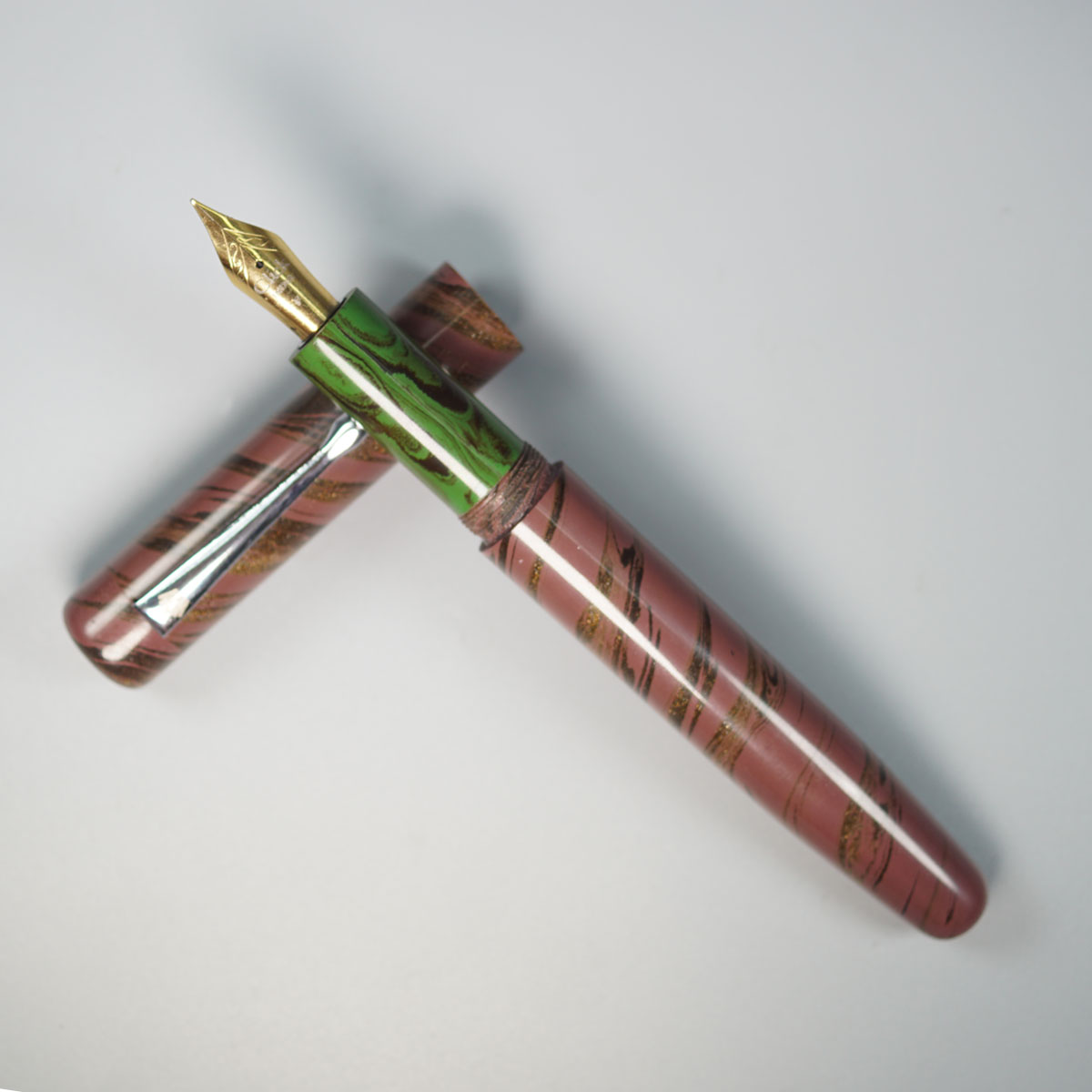 WOW Brand Model-1003A Durga (துர்கா) Classic Ebonite Maroon With Black And Gold Color Body Silver Clip Green Color Grip Section Cap Type Eyedropper Plus Cartridge And Converter Fountain Pen SKU 60054