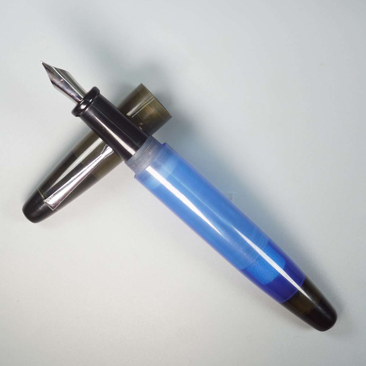 WOW Brand Model-1013A Sabyasachi Celestine சப்யசாச்சி செலஸ்டின் 20/20mm Handmade Acrylic Blue Color Body with Black Color Cap Black Ebonite Grip Silver Clip Eyedropper Plus Cartridge And Converter Fountain Pen with Jowo  Medium Nib Thread SKU 60098
