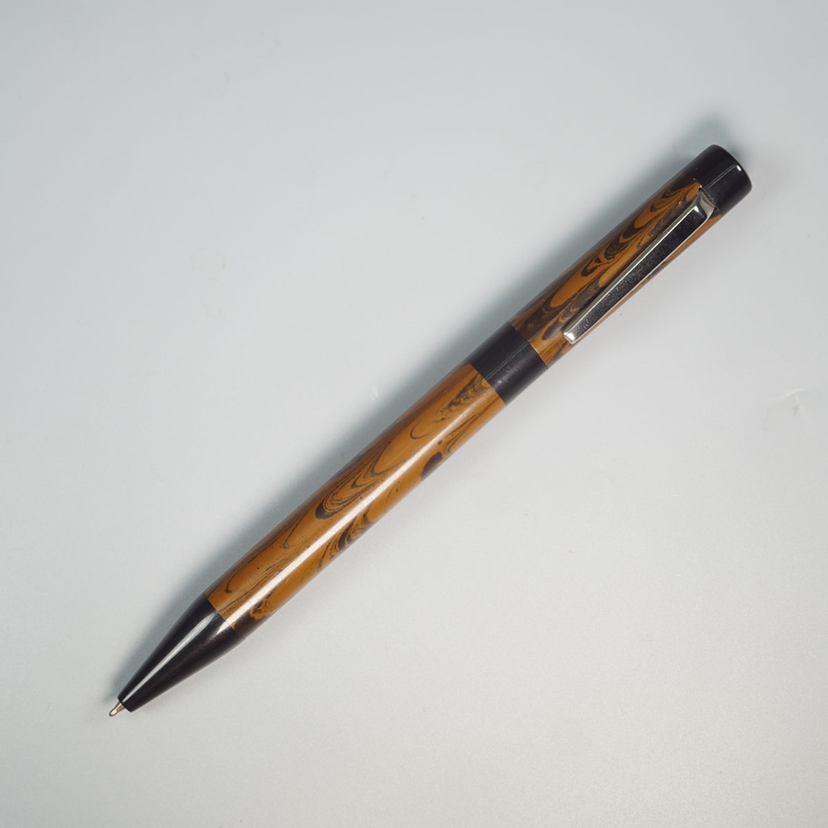 WOW Brand Model-1040A Mayilmai மயில்மை Brown and Black Color Ebonite Body  Black Trim With Silver Clip Twist Type Ball Pen SKU 60106