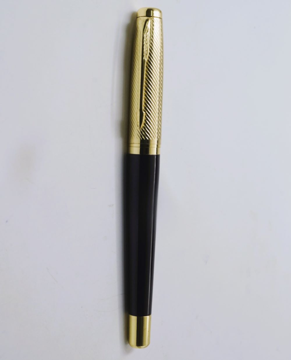 penhouse.in Black Color Body With Gold Cap And Clip Black Color Grips Medium tip Roller ball pen SKU 26852