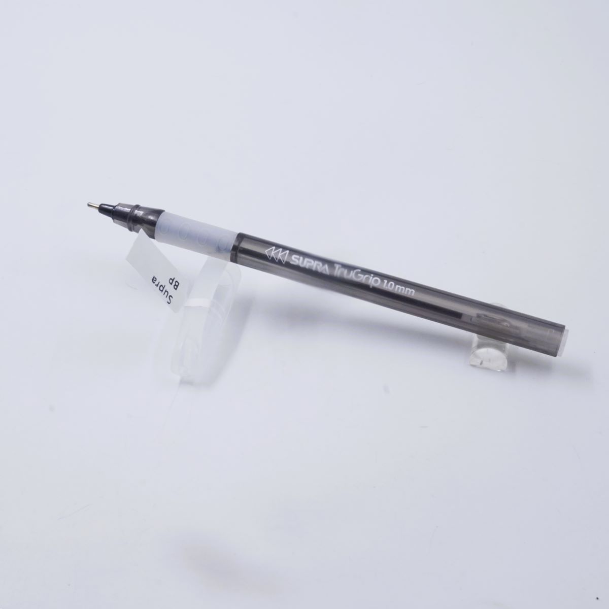Supra Trugrip 1.0mm Transparent Black Body White Color Cap Type Black Writting Ball Pen SKU 27057