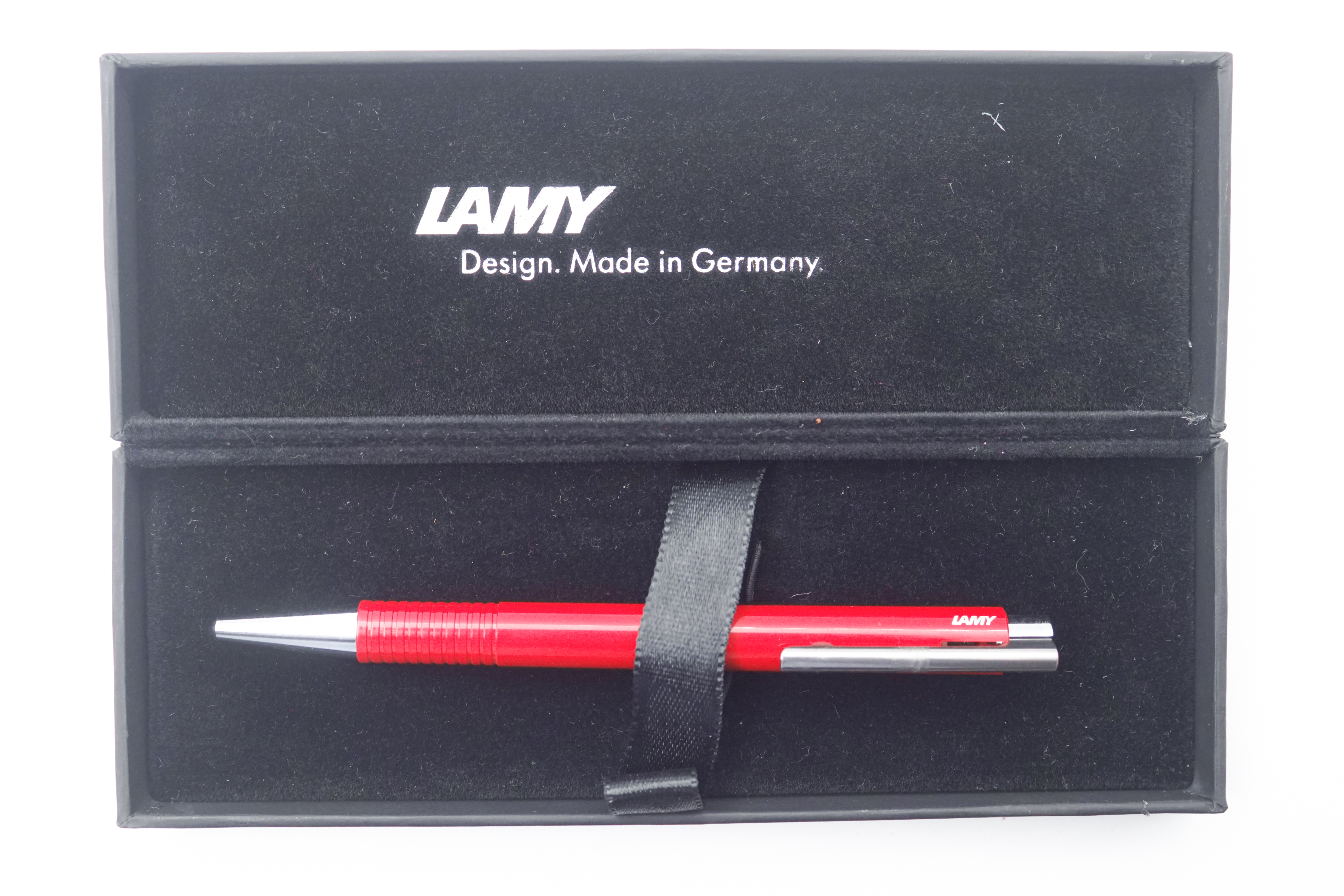 Lamy Logo 4026554 204 Glassy Red Color Body With Silver Clip Retractble Medium Tip Ball Pen SKU 24820