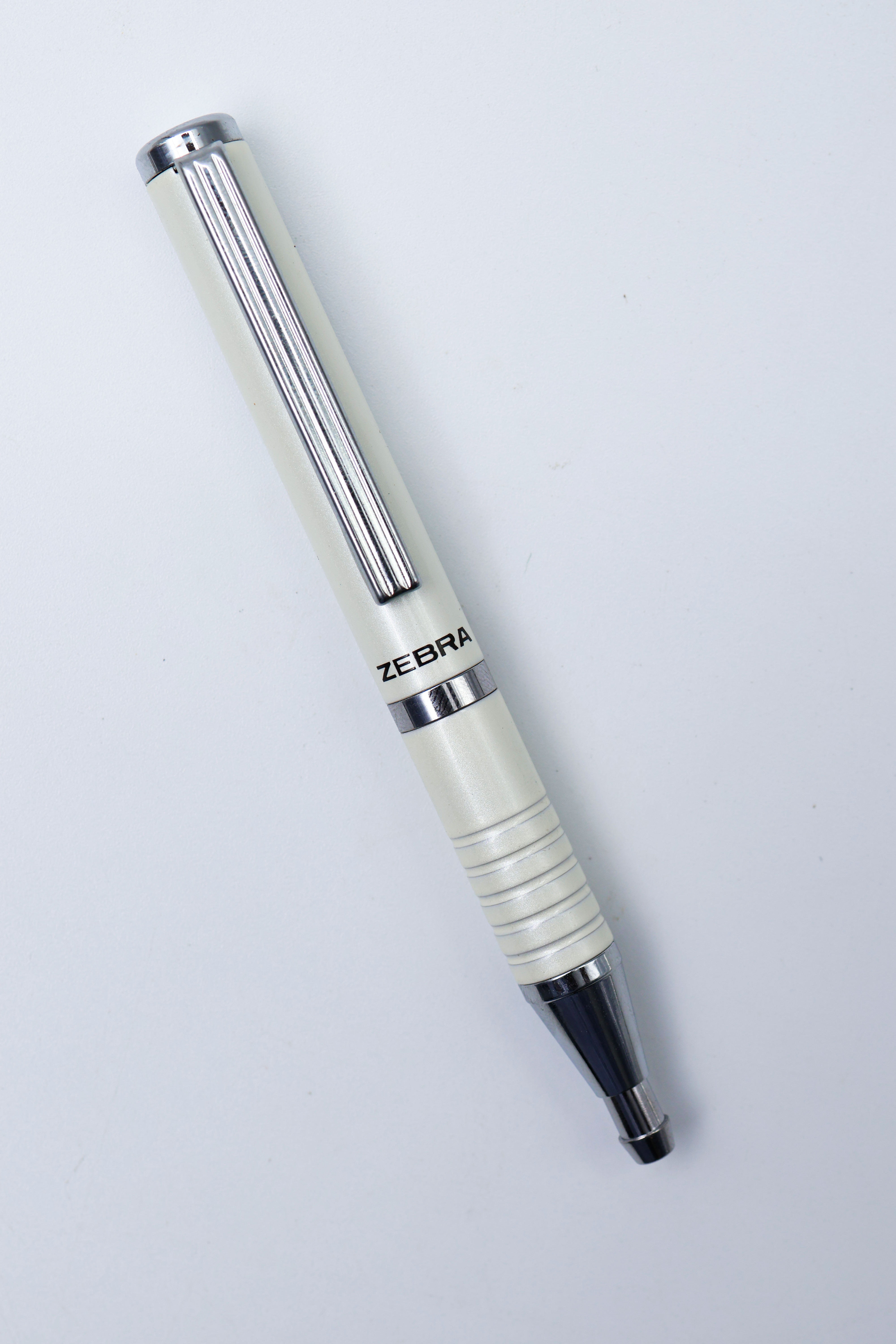 Zebra SL-F1 BA115 Mini Pearl White Color Body Expand Cap Pull Type Ball Pen SKU 24828