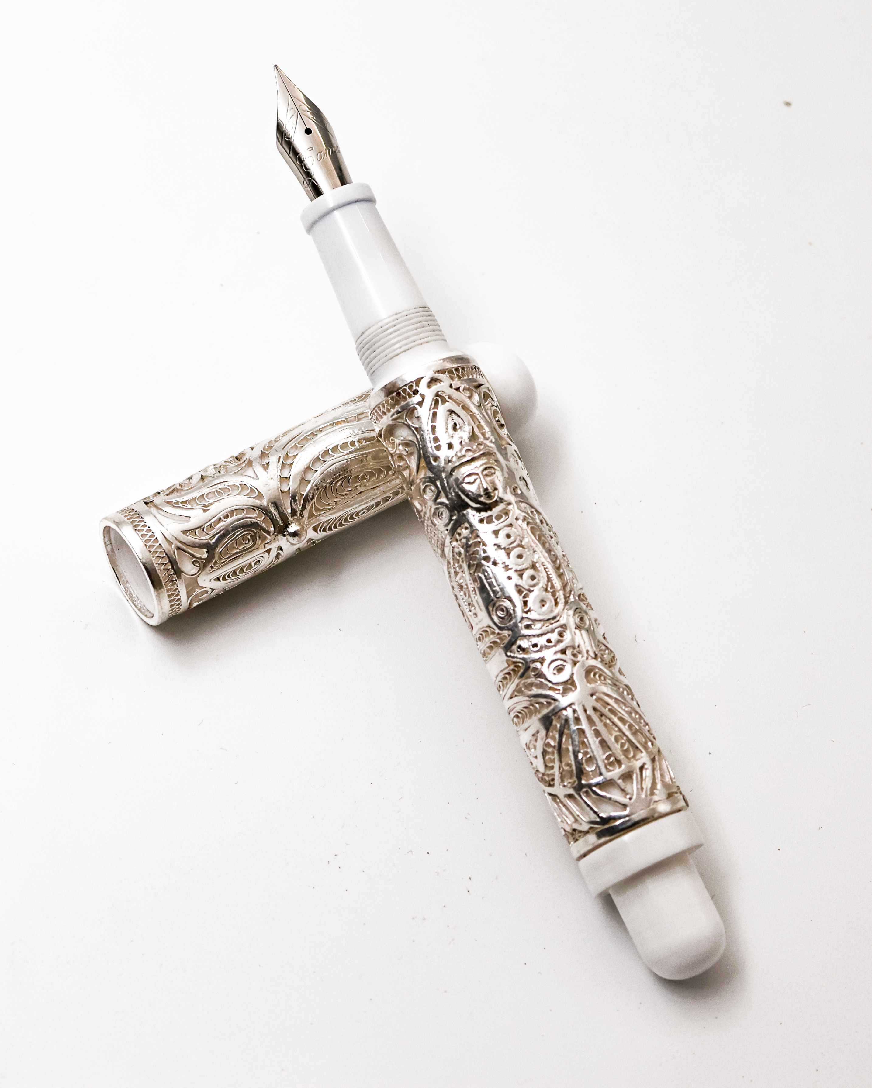 Gama Filigree Model Converter Type Fountain Pen has Fine Nib White Color Body With Original Silver Embedded Goddess Mahalakshmi on The Barrel And Lotus Symbol on The Cap SKU 24899