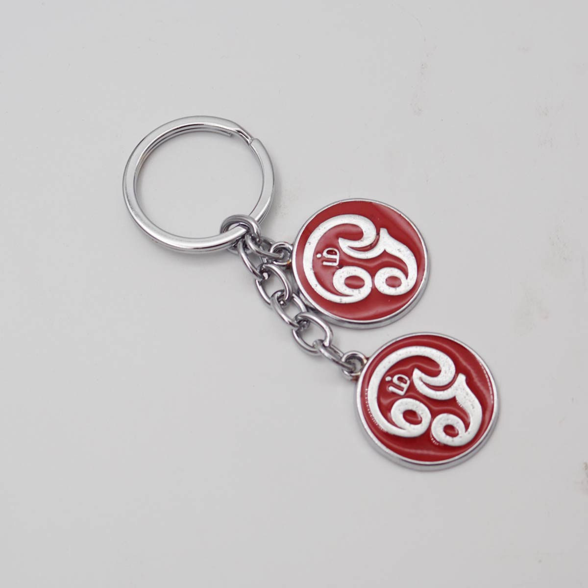 Penhouse.in Om Muruga From Tamil Text in a Red Color Circular Background Two Keychain SKU KP245
